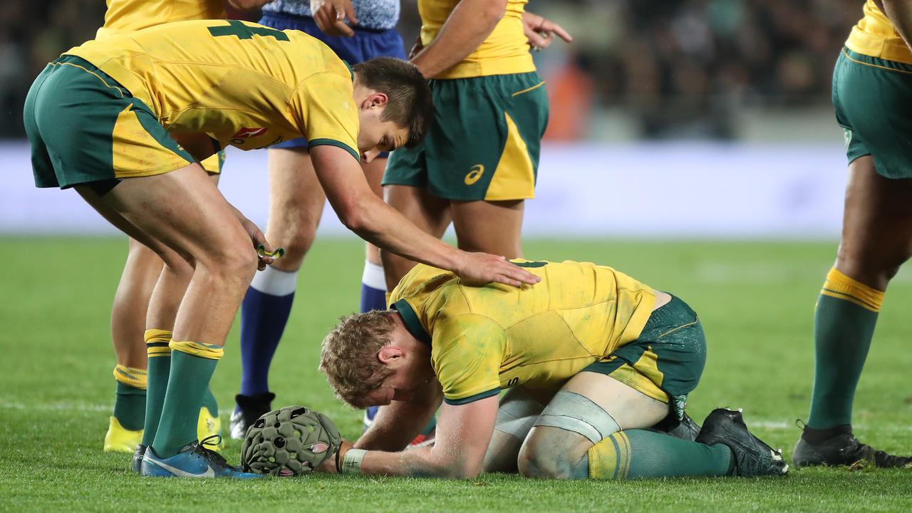 Jack Maddocks comforts David Pocock during a Bledisloe Cup match.