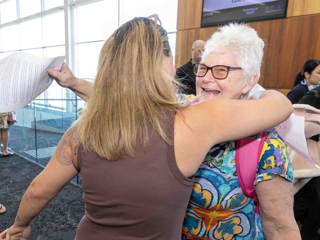 December 10, 2024: Ashley Scholz hugs her mum Heather White from Toronto,Canada, who was a passenger on Qantas FLIGHT QF1929  at Adelaide Airport, after it was forced to turn back to Brisbane and excuse an emergency landing.  Picture: Kelly Barnes