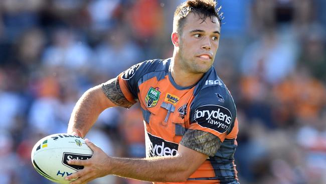 Luke Brooks looks to pass the ball against the Melbourne Storm.