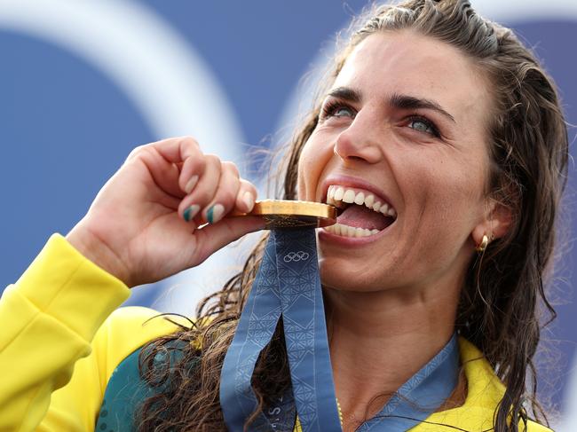 PARIS, FRANCE - JULY 28: Gold Medalist Jessica Fox of Team Australia bites her medal as she poses on the podium during the Canoe Slalom medal ceremony after the WomenÃ¢â¬â¢s Kayak Single Final on day two of the Olympic Games Paris 2024 at Vaires-Sur-Marne Nautical Stadium on July 28, 2024 in Paris, France. (Photo by Justin Setterfield/Getty Images)