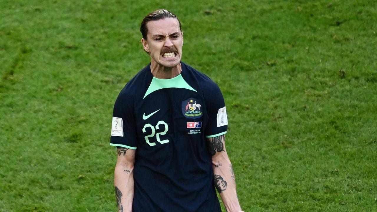 Australia's midfielder #22 Jackson Irvine was the recipient of Giroud’s jersey. (Photo by Jewel SAMAD / AFP)