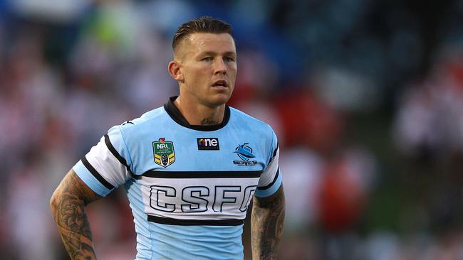 Former Shark Todd Carney looks on.