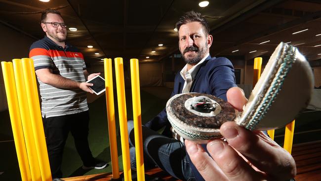 Former Test cricketer and Jetson Industries board member Mike Kasprowicz, right, shows off a connected cricket ball with Jetson founder Ben Tattersfield. Picture: Lyndon Mechielsen