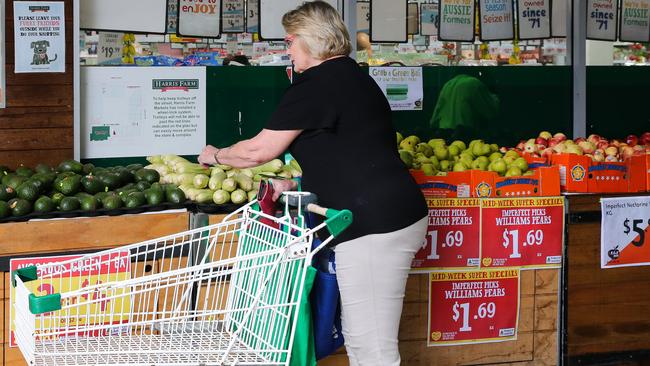 SYDNEY, AUSTRALIA -  Newswire Photos MARCH 14 2023 - A member of the public is seen buying produce and groceries in Sydney as the Cost of living continues to rise. Picture: NCA Newswire / Gaye Gerard.