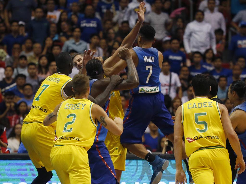 The Philippines and Australian basketball players react, during the FIBA World Cup Qualifiers Monday, July 2, 2018 at the Philippine Arena in suburban Bocaue township, Bulacan province north of Manila, Philippines. Australia defeated the Philippines 89-53 via default following a brawl in the third quarter. (AP Photo/Bullit Marquez)