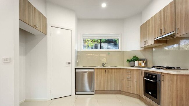 The kitchen has a gas cook top, soft-close cupboards and a dishwasher.