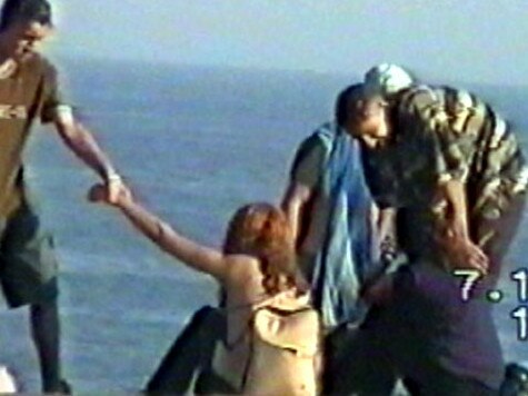 Police surveillance pictures of gang rapists Mohammed Skaf (left) and Tayyab Sheikh, with two unidentified young women on Bondi Beach on October 7, 2000.