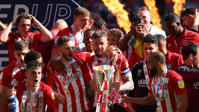 Brentford captain Pontus Jansson and his teammates lift the trophy after winning the Sky Bet Championship Play-off Final against Swansea City at Wembley Stadium. Picture: Getty Images