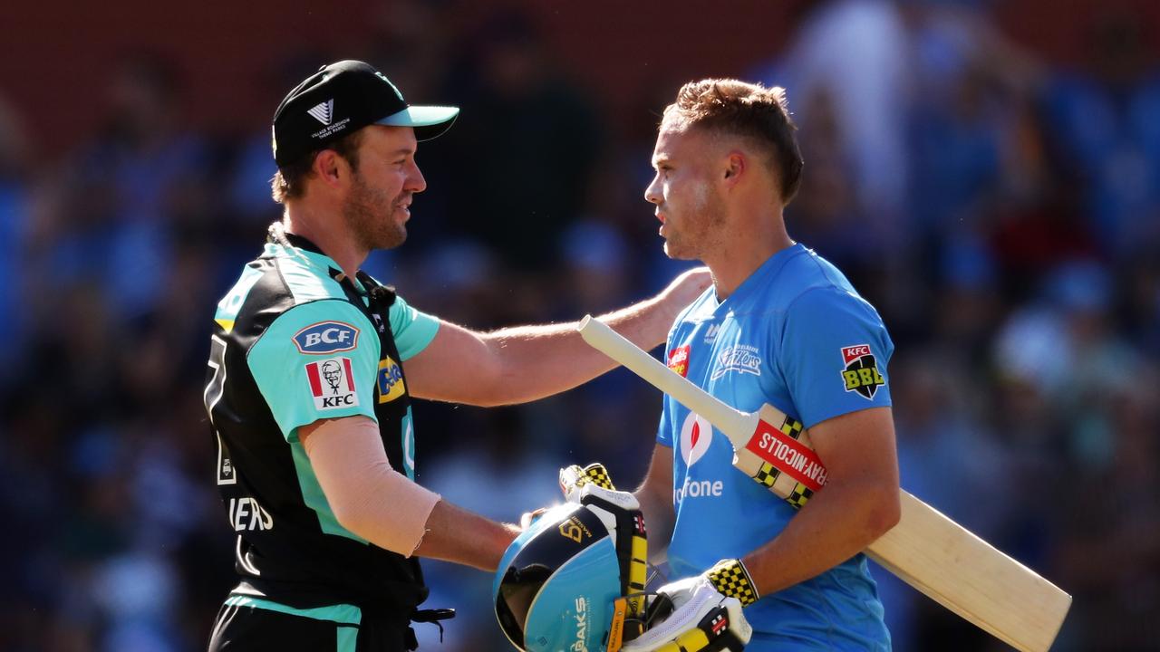 AB de Villiers of the Heat congratulates Phil Salt of the Strikers after he hit the winning runs