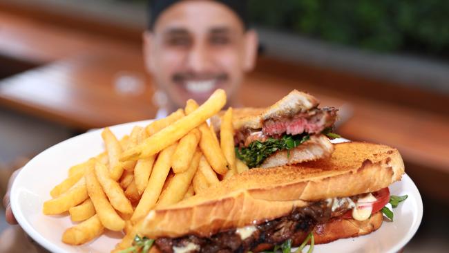 Sous chef Manish Basnet with the award-winning steak sandwich. Picture: Angelo Velardo