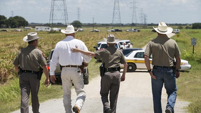 Law enforcement at the scene of Saturday’s hot air balloon crash near Lockhart, Texas.