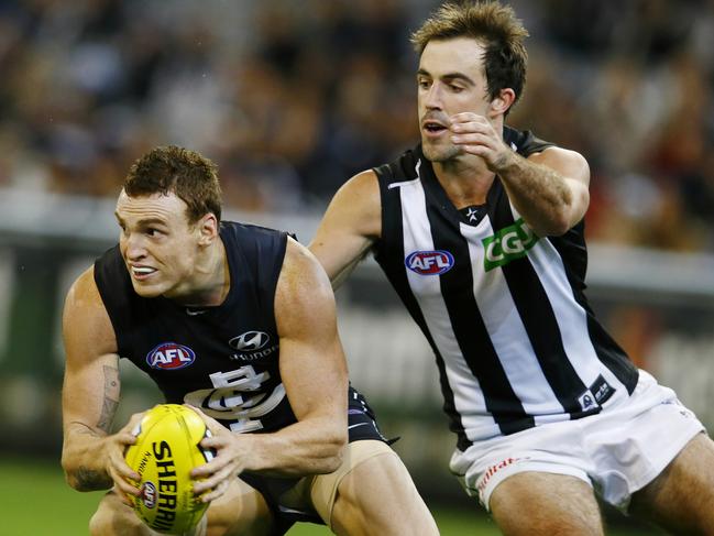 Mitch Robinson evades Steele Sidebottom during his playing career at Carlton. Picture: Michael Klein