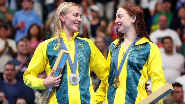 NANTERRE, FRANCE - JULY 29: Gold Medalist Mollie O'Callaghan (R) and Silver Medalist Ariarne Titmus of Team Australia (L) celebrate on the podium during the Swimming medal ceremony after the WomenÃ¢â¬â¢s 200m Freestyle Final on day three of the Olympic Games Paris 2024 at Paris La Defense Arena on July 29, 2024 in Nanterre, France. (Photo by Sarah Stier/Getty Images)