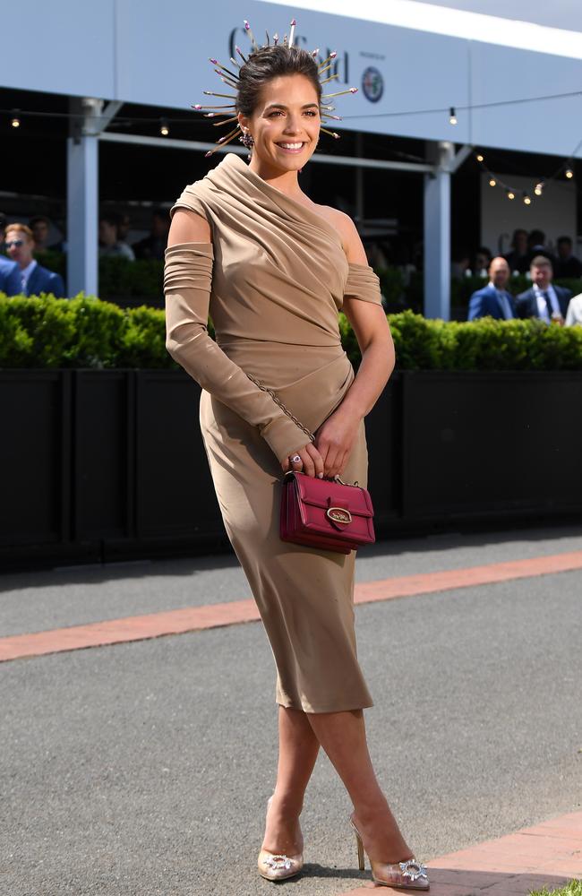 The actress and model chose a Coach clutch for a pop of colour. Picture: AAP/James Ross