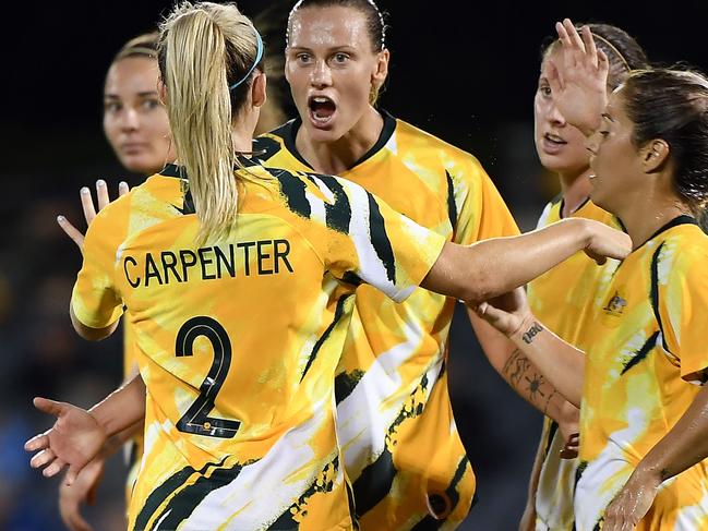 Australia's Emily Van Egmond (C) celebrates her second goal during the women's Olympic football qualifying match between Australia and Thailand at Campbelltown Stadium in Sydney on February 10, 2020. (Photo by Saeed KHAN / AFP) / -- IMAGE RESTRICTED TO EDITORIAL USE - STRICTLY NO COMMERCIAL USE --