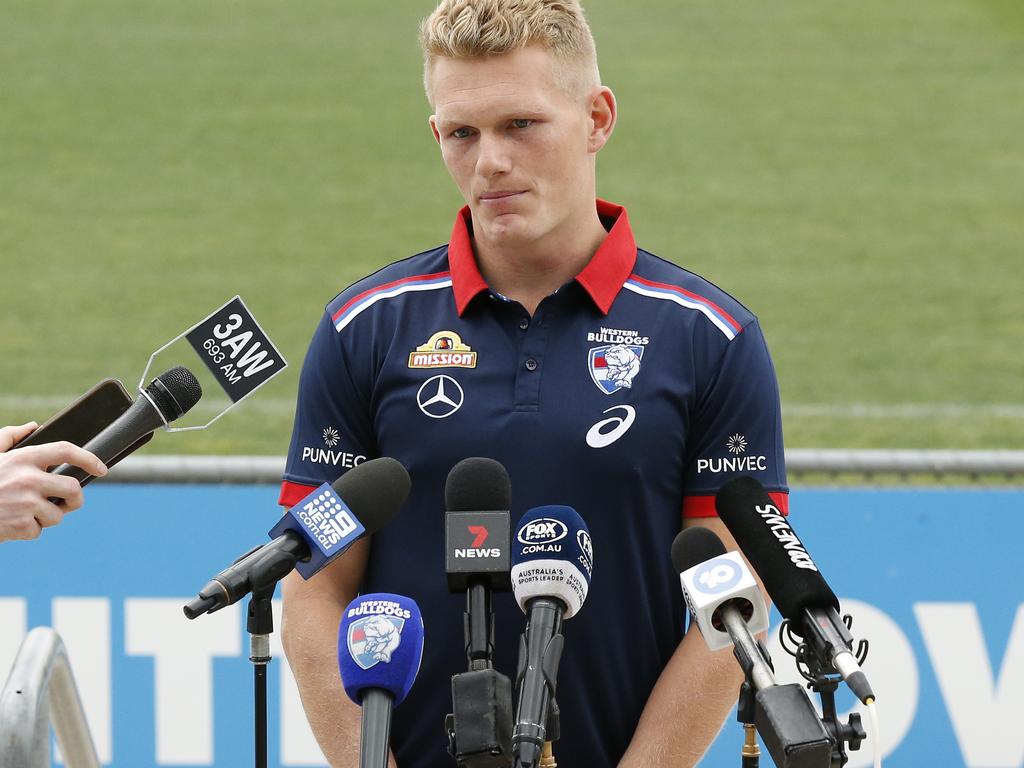 Adam Treloar in different colours after being forced out by the Magpies.