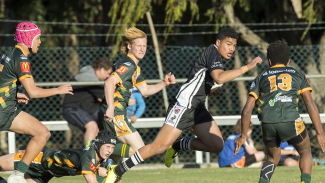 Prinston Esera bursts through in a club match for Souths Juniors. He will play Langer Cup for Wavell SHS. (AAP Image/Richard Walker)