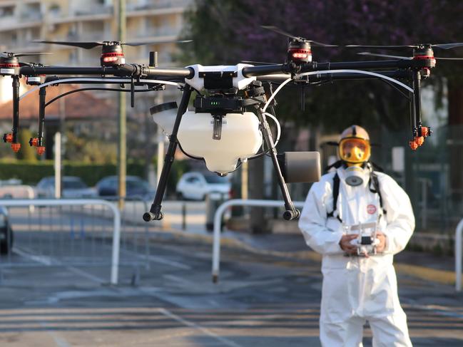 A technician flies a drone that will spray disinfectant along the streets of Cannes. The city’s famed film festival has been officially cancelled “in its original form”. Picture: AFP