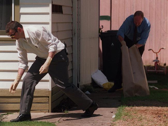 Police at the Niddrie home where Jane Thurgood-Dove was murdered in a case of mistaken identity.