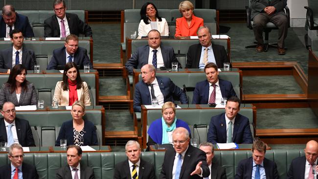 Liberal member for Chisholm Julia Banks and former Liberal deputy leader Julie Bishop (back) listen to Prime Minister Scott Morrison during Question Time in the House of Representatives at Parliament House in Canberra, Monday, September 10, 2018. Picture: AAP