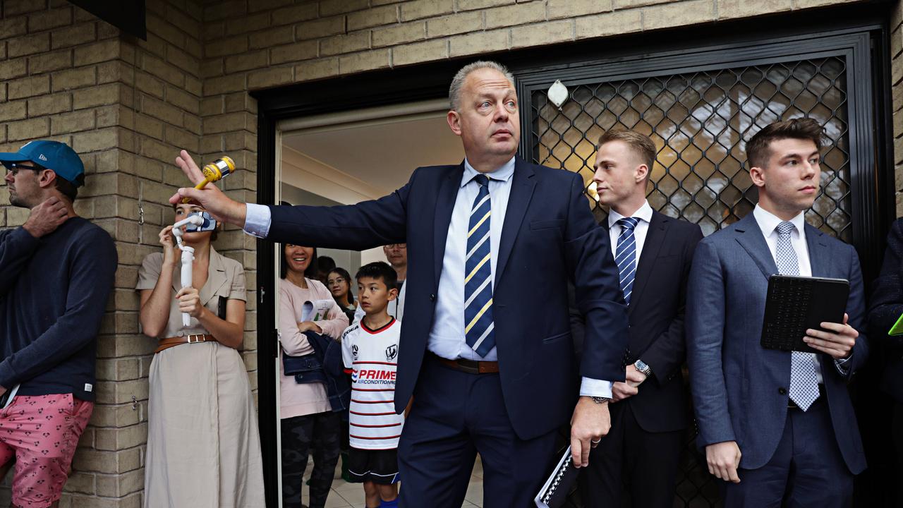 Auctioneer Jason Keen conducts the auction. Picture: Adam Yip