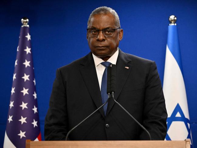 (FILES) US Secretary of Defence Lloyd Austin looks on during a joint press conference with Israel's defence minister, in Tel Aviv on December 18, 2023. US Defense Secretary Lloyd Austin was hospitalized earlier this week due to complications from a medical procedure, the Pentagon said January 5, 2024 at a time when Washington is facing a growing crisis in the Middle East. (Photo by Alberto PIZZOLI / AFP)