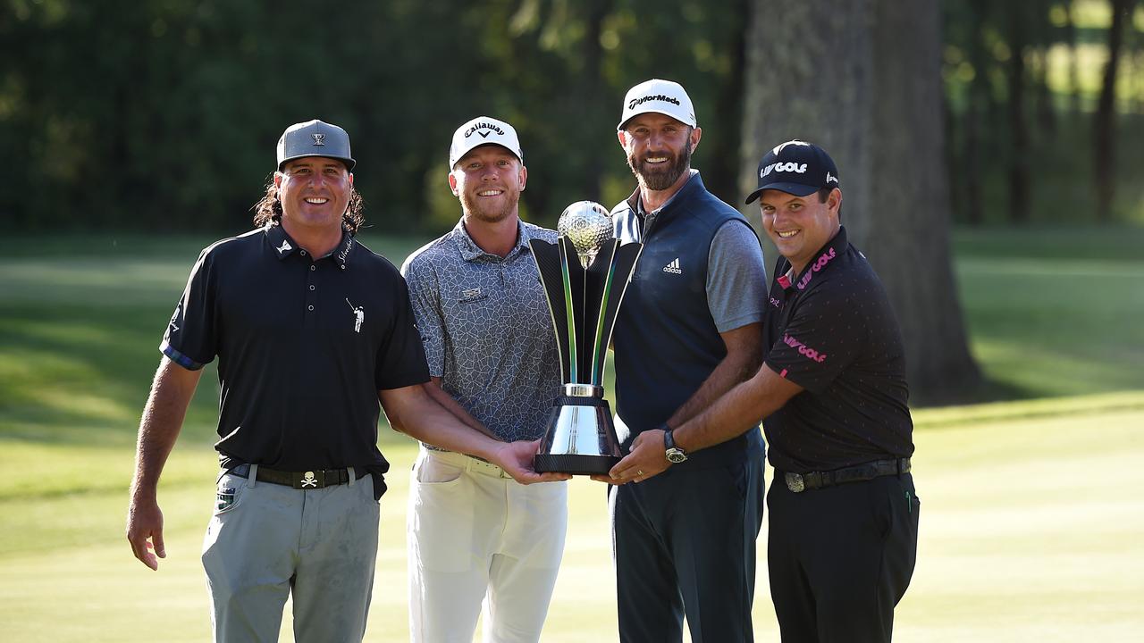 Pat Perez, Talor Gooch, Dustin Johnson, and Patrick Reed pose with the trophy after winning the team title at the LIV Golf Invitational.