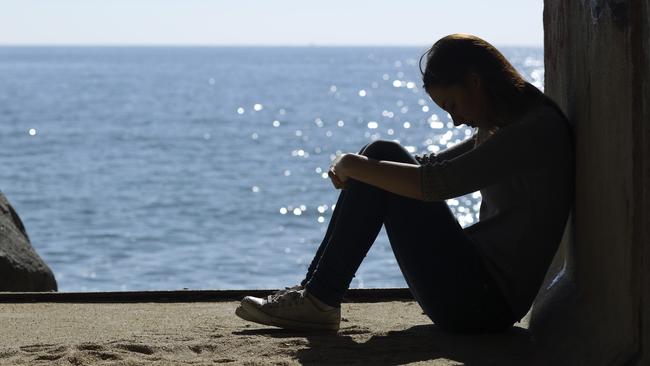 Teenage girl looking unhappy