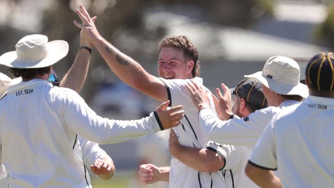 Cricket GCA3 - Marshall v Waurn Ponds Deakin.Marshall bowler Blayke Sadler bowls Waurn Ponds Deakin batsman Ethan Rogers  with Jayke Sadler with team celebratingPicture: Mark Wilson