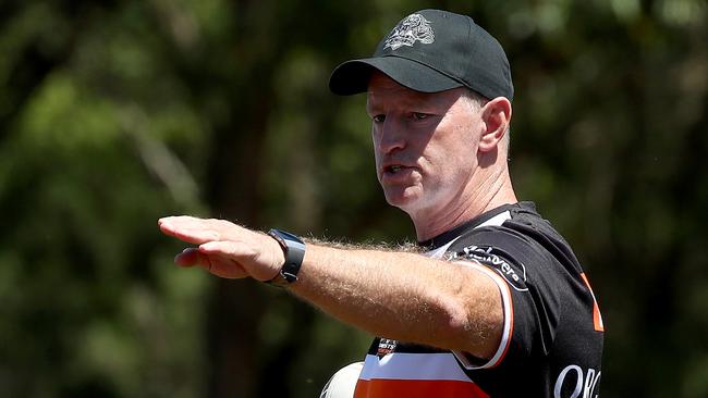 Wests Tigers hit the training track at the start of pre season at St Lukes Park in Concord. Coach Michael Maguire issues instructions to the players. Picture: Toby Zerna