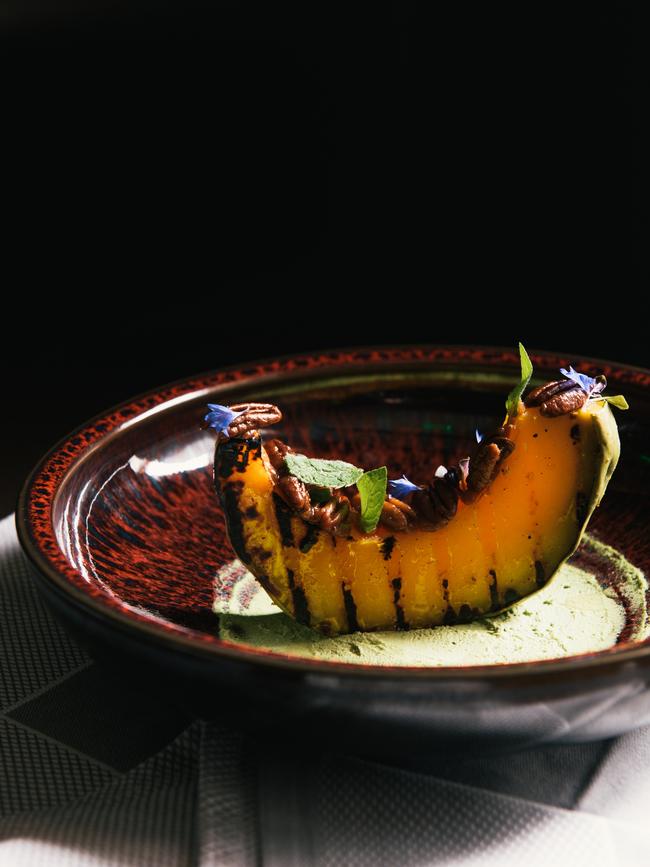 Heirloom pumpkin with pecans, dates, mint and borage flowers at Montage Healdsburg restaurant Hazel Hill. Picture: Matt Dutile