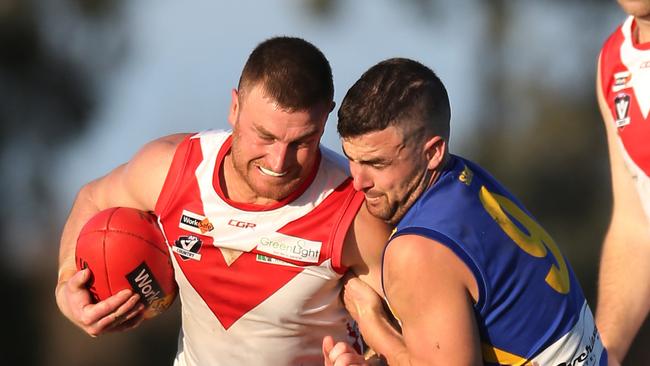 Tyler Pedretti (right) of Shepparton East tackles an Avenel opponent. Picture: Yuri Kouzmin