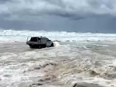 The ute surrounded by water at Currumbin.