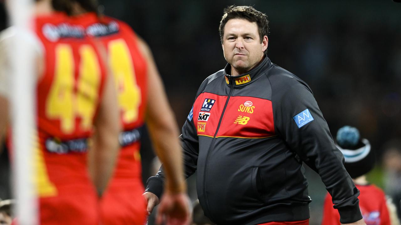 ADELAIDE, AUSTRALIA - JULY 08:Stuart Dew coach of the Suns heads to the rooms at half time during the round 17 AFL match between Port Adelaide Power and Gold Coast Suns at Adelaide Oval, on July 08, 2023, in Adelaide, Australia. (Photo by Mark Brake/Getty Images)