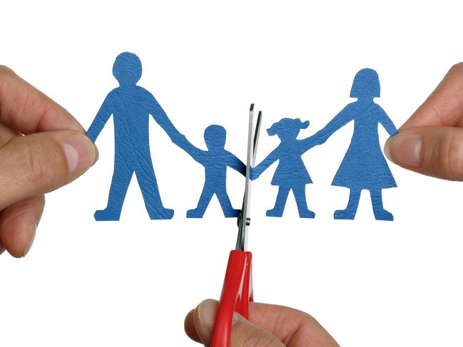 Thinkstock - Divorce: Paper chain family divorce held by hands and scissors cutting family apart.