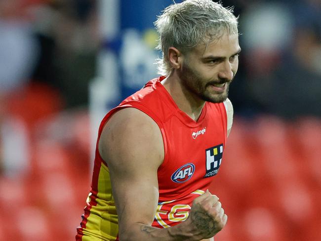 GOLD COAST, AUSTRALIA - AUGUST 13: Izak Rankine of the Suns celebrates a goal during the 2022 AFL Round 22 match between the Gold Coast Suns and the Geelong Cats at Metricon Stadium on August 13, 2022 in the Gold Coast, Australia. (Photo by Russell Freeman/AFL Photos via Getty Images)