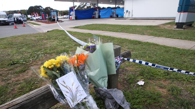Flowers and tributes left at the Queanbeyan servo after the incident. Picture: Kym Smith