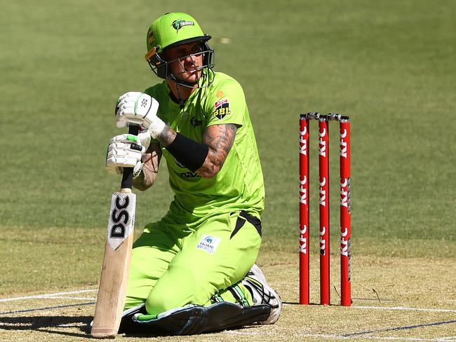 PERTH, AUSTRALIA - JANUARY 07: Alex Hales of the Thunder looks on after being struck by the ball during the Big Bash League match between the Hobart Hurricanes and the Sydney Thunder at Optus Stadium, on January 07, 2021, in Perth, Australia. (Photo by Paul Kane/Getty Images)