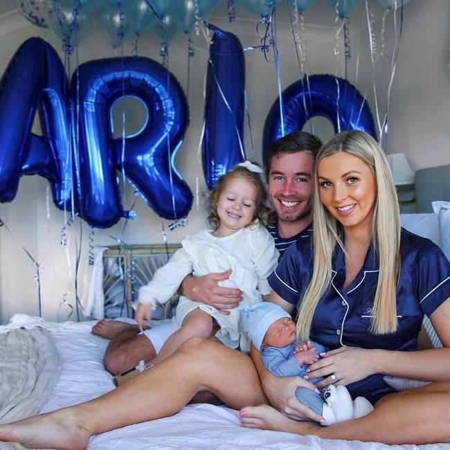 Hannah holding her new baby boy Arlo, together with her daughter Evaliah and partner Grant Small.