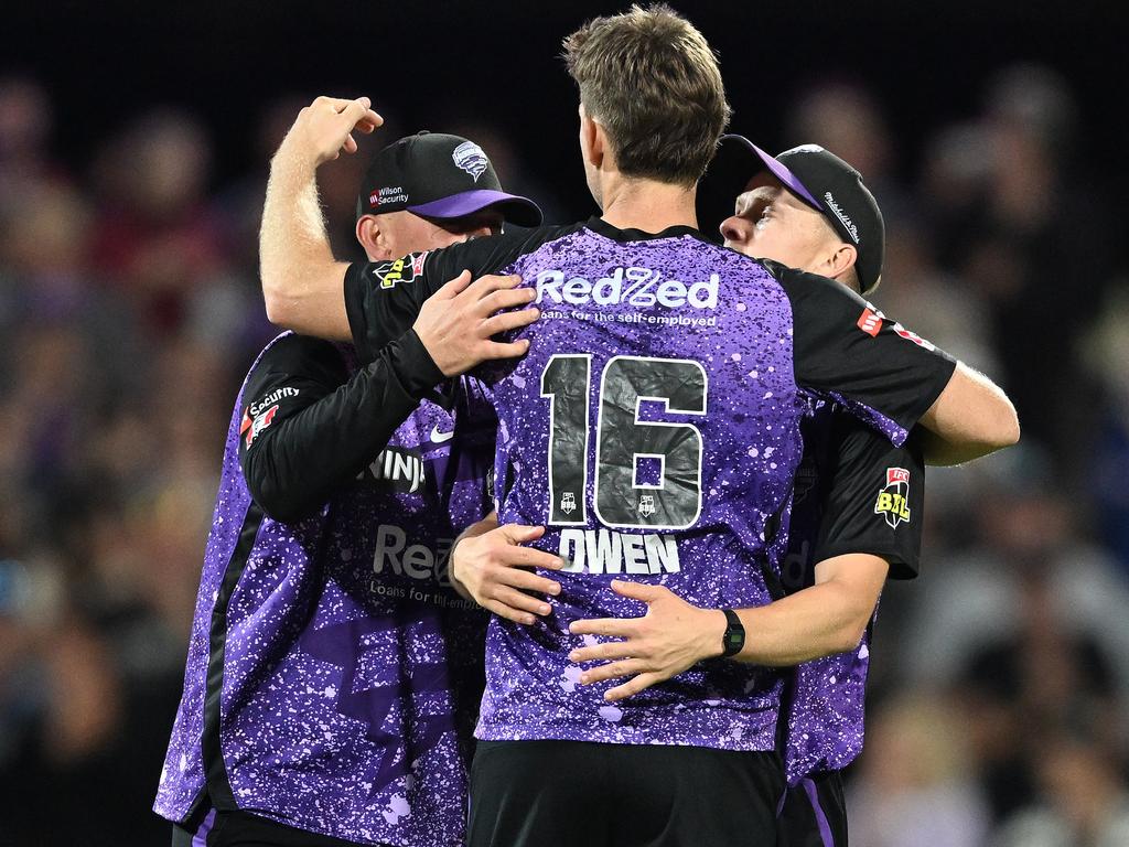 Mitch Owen,Nathan Ellis and Ben McDermott of the Hurricanes celebrate the win. (Photo by Steve Bell/Getty Images)