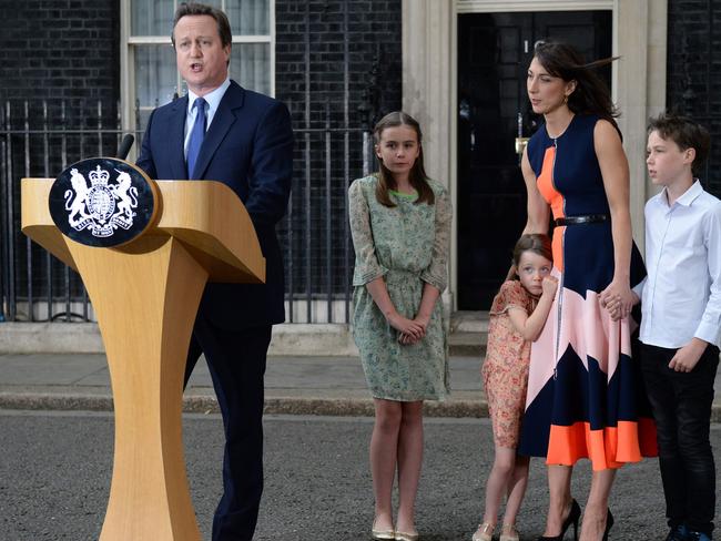 Outgoing British prime minister David Cameron speaks beside (L-R) his daughter Nancy Gwen, daughter Florence Rose Endellion, his wife Samantha Cameron and son Arthur Elwen outside 10 Downing Street in central London on July 13, 2016 before going to Buckingham Palace to tender his resignation to Queen Elizabeth II. Picture: AFP PHOTO / OLI SCARFF