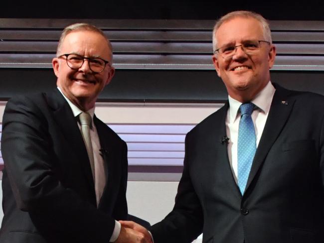 Australian Prime Minister Scott Morrison and Australian Opposition Leader Anthony Albanese shake hands during the third leaders' debate at Seven Network Studios on Day 31 of the 2022 federal election campaign, in Sydney, Wednesday, May 11, 2022. (AAP Image/Mick Tsikas) NO ARCHIVING