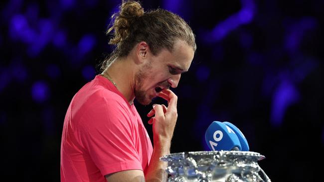 Germany's Alexander Zverev prepares to address the crowd after defeat against Italy's Jannik Sinner during their men's singles final match on day fifteen of the Australian Open tennis tournament in Melbourne on January 26, 2025. (Photo by DAVID GRAY / AFP) / -- IMAGE RESTRICTED TO EDITORIAL USE - STRICTLY NO COMMERCIAL USE --