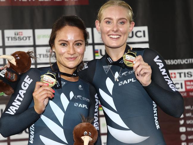 Natasha Hansen, left, and Olivia Podmore of New Zealand celebrate with their gold medals following the Womens Team Sprint at 2019 world championships.