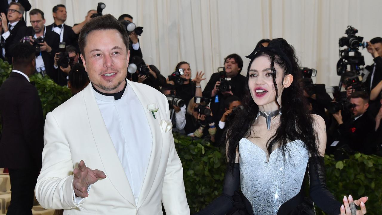 Elon Musk and Grimes. (Photo by ANGELA WEISS / AFP)