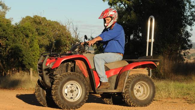 An ATV with a protective quad bar fitted to the back.