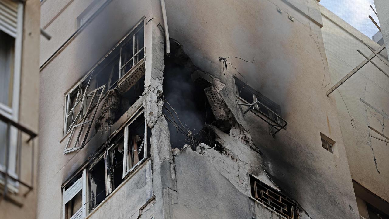 A residential building in Tel Aviv is damaged following a rocket attack from the Gaza Strip into Israel. Picture: Jack Guez / AFP