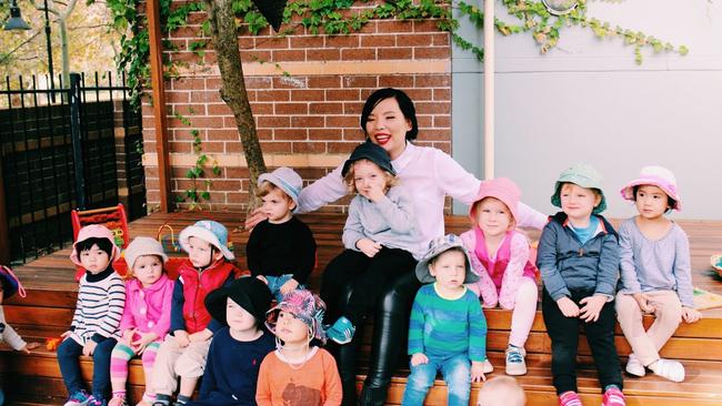 Future fans ... Dami Im takes over reading duties at a childcare centre to make the littlest fans happy. Picture: Supplied.