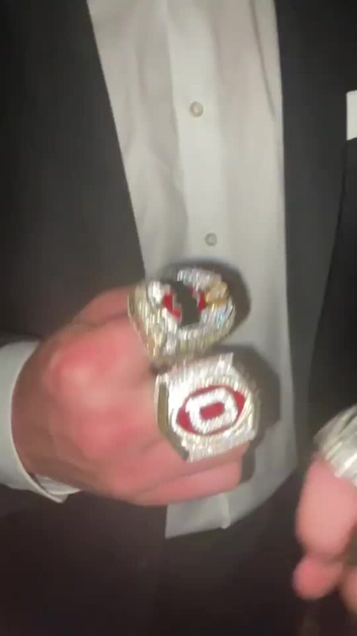 Rings of glory: Joe McGuire flashes gridiron bling