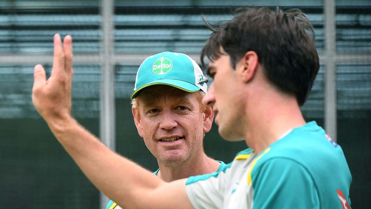 Captain Pat Cummins (R) speaks with coach Andrew McDonald (L) will lead Australia on their historic tour of Pakistan. Photo: AFP